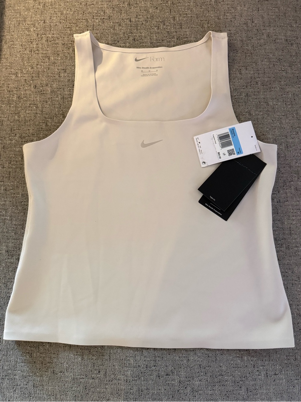 Nike Women’s Light Cream Tank Top with Subtle Logo - Smoothing Material